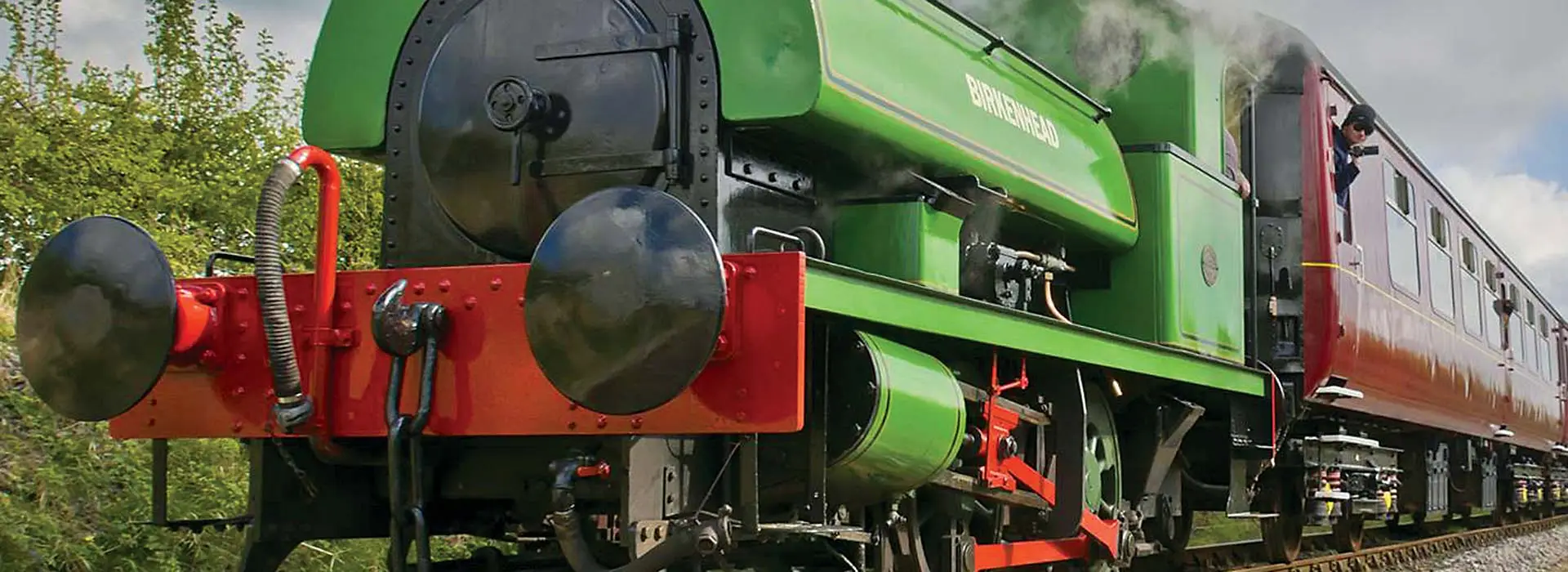 Footplate crew leaning from a steam locomotive