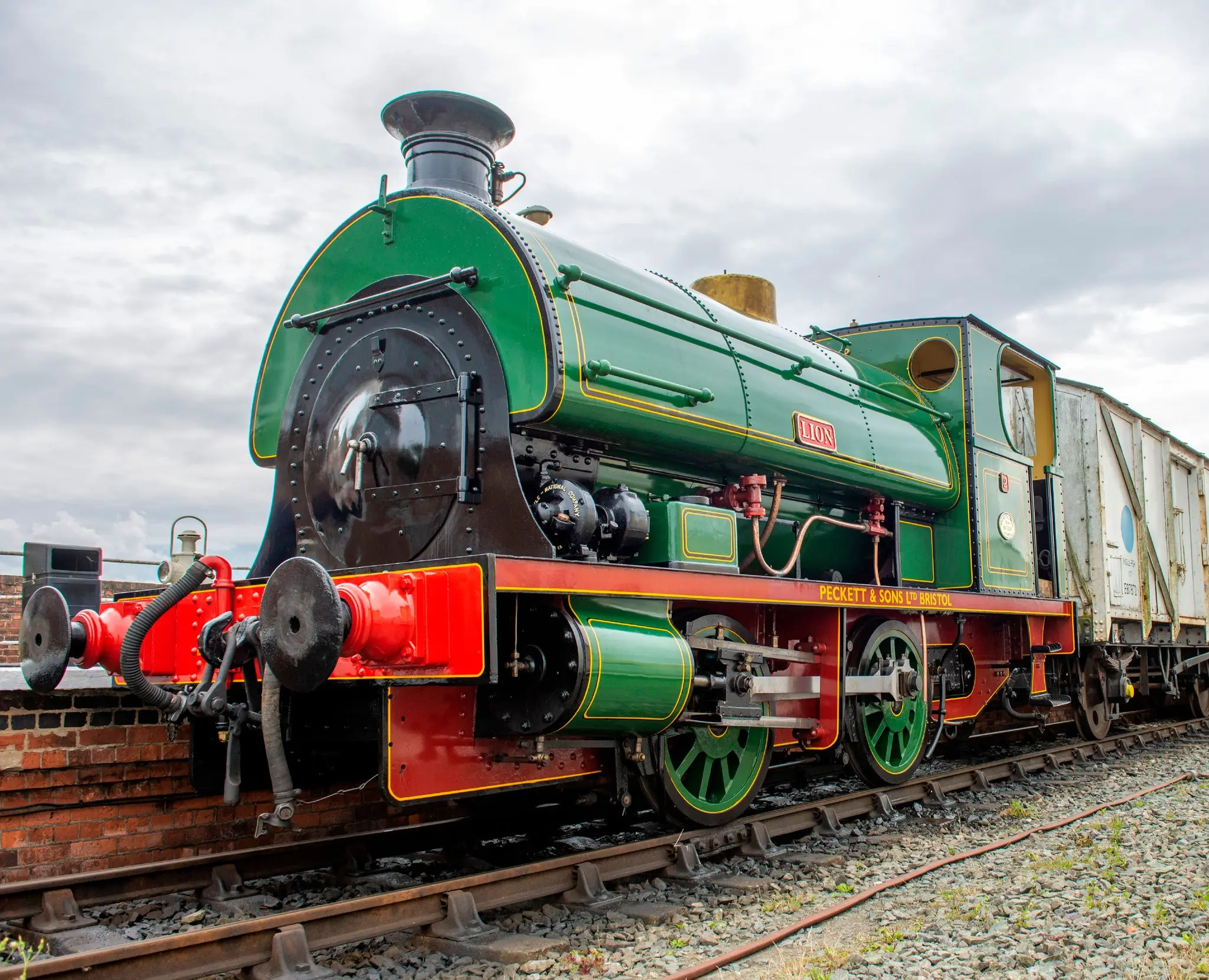 Restored green Peckett saddle-tank locomotive